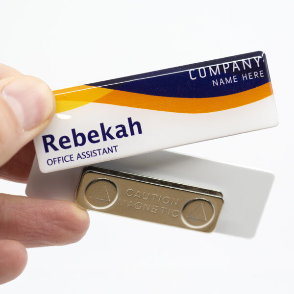 Magnetic name badge showing the name Rebekah and the title Office Assistant, with a magnetic backing plate.